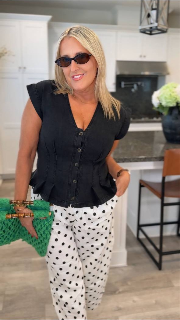 Black peplum top with polka dot pants
