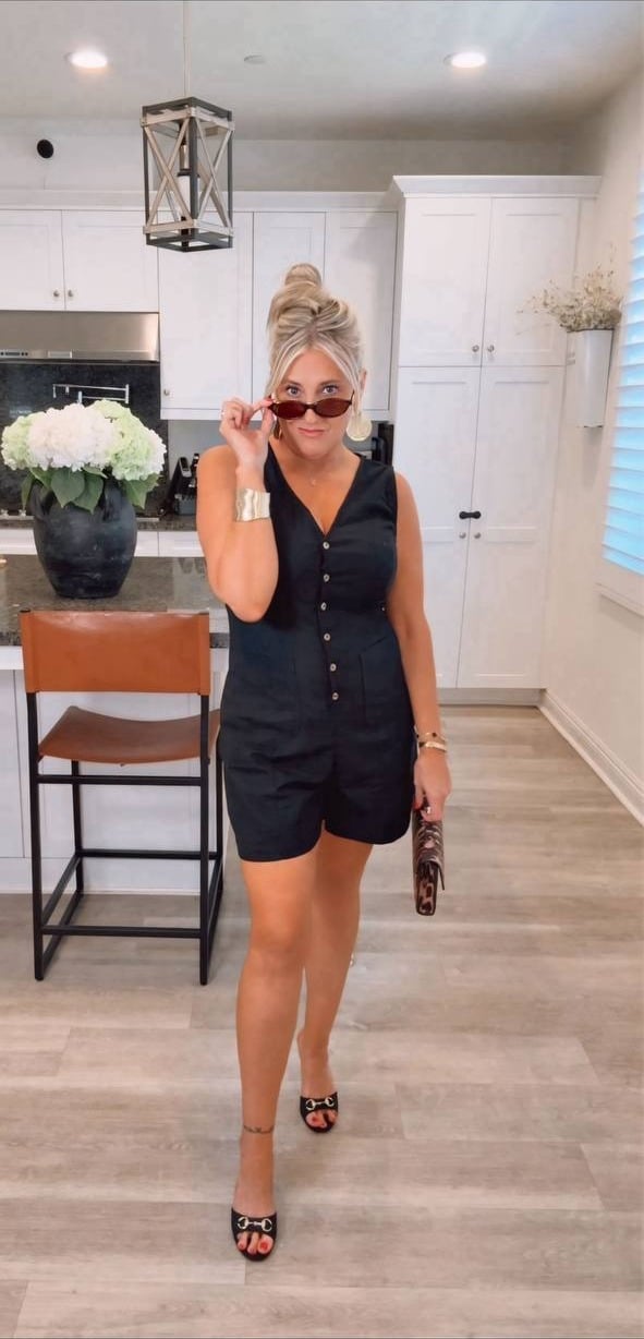Black sleeveless button romper